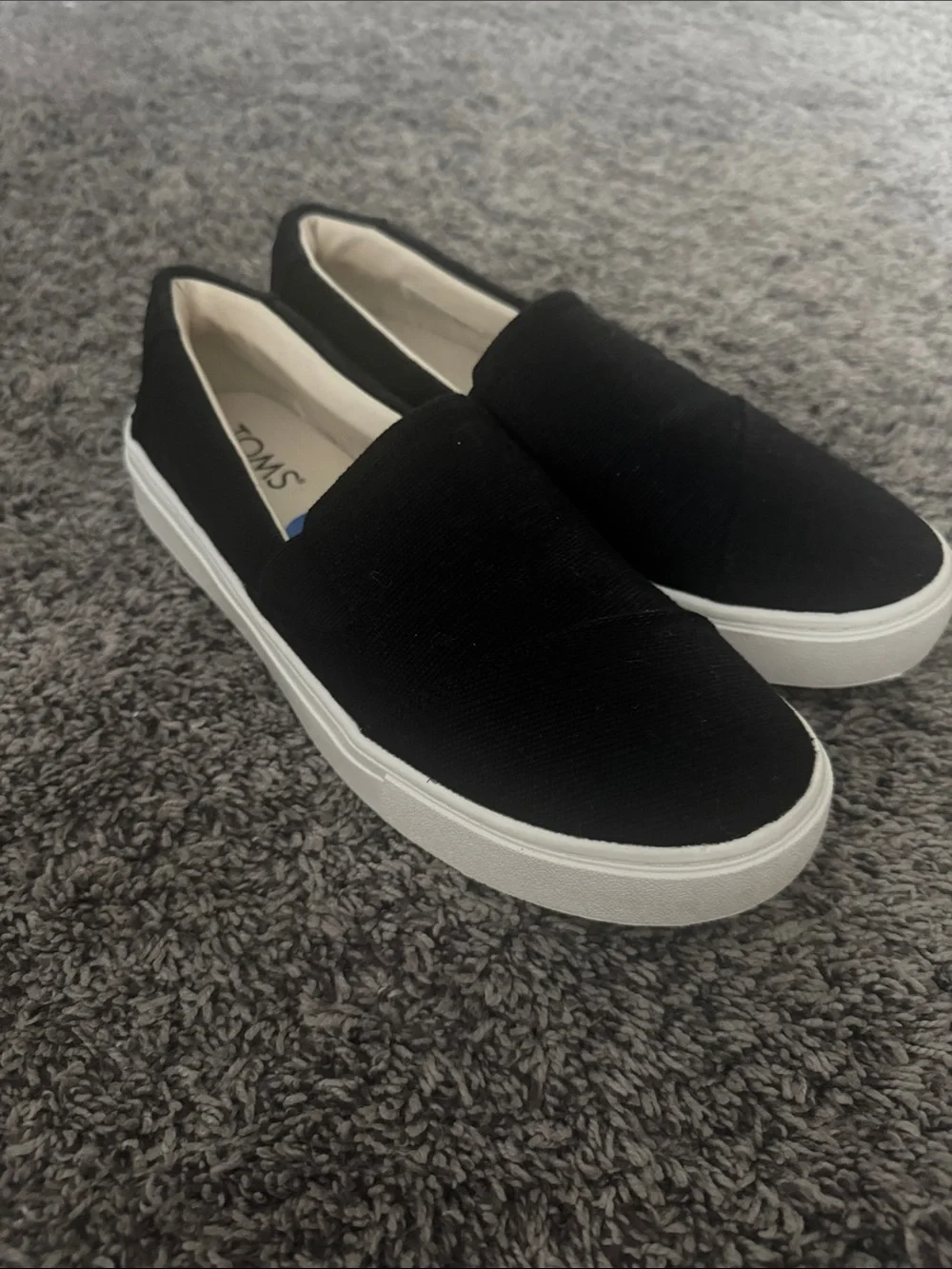 Woman’s Toms Black Canvas Slip-On Sneakers with White Sole